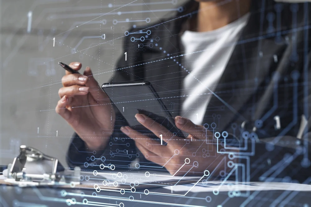 Business professional using a tablet with digital data overlays symbolizing fintech KYC checks, identity verification steps, and real-time risk scoring during onboarding