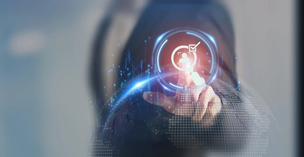 A compliance analyst touching a digital identity verification icon representing perpetual KYC and real-time customer risk monitoring