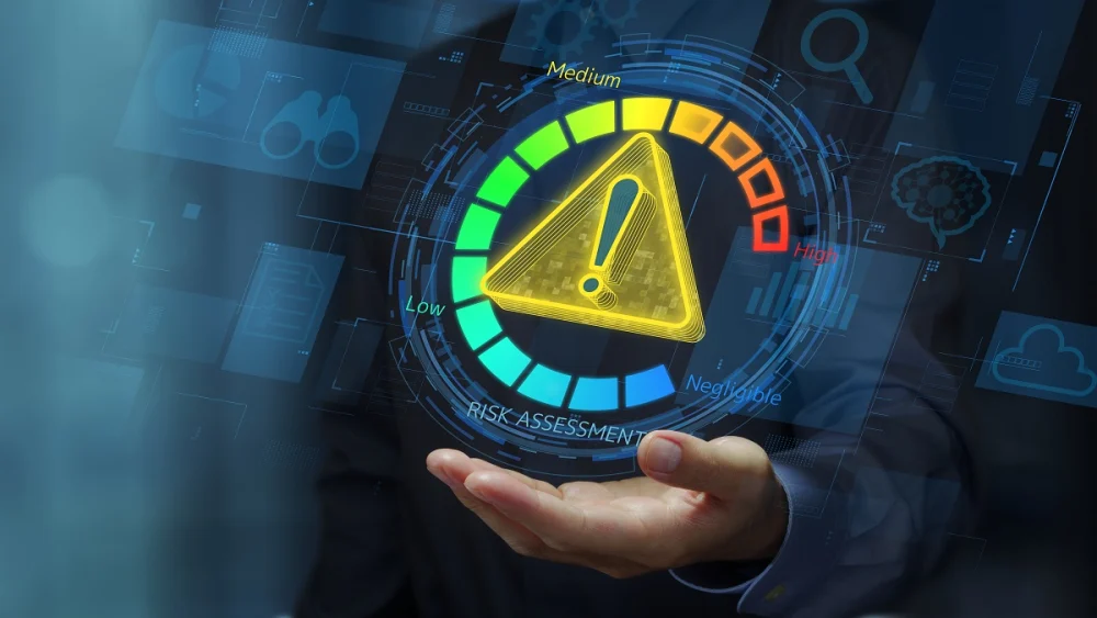 Risk assessment dashboard with a warning symbol showing low-to-high risk levels, illustrating how KYC identifies high-risk customers and fraud indicators