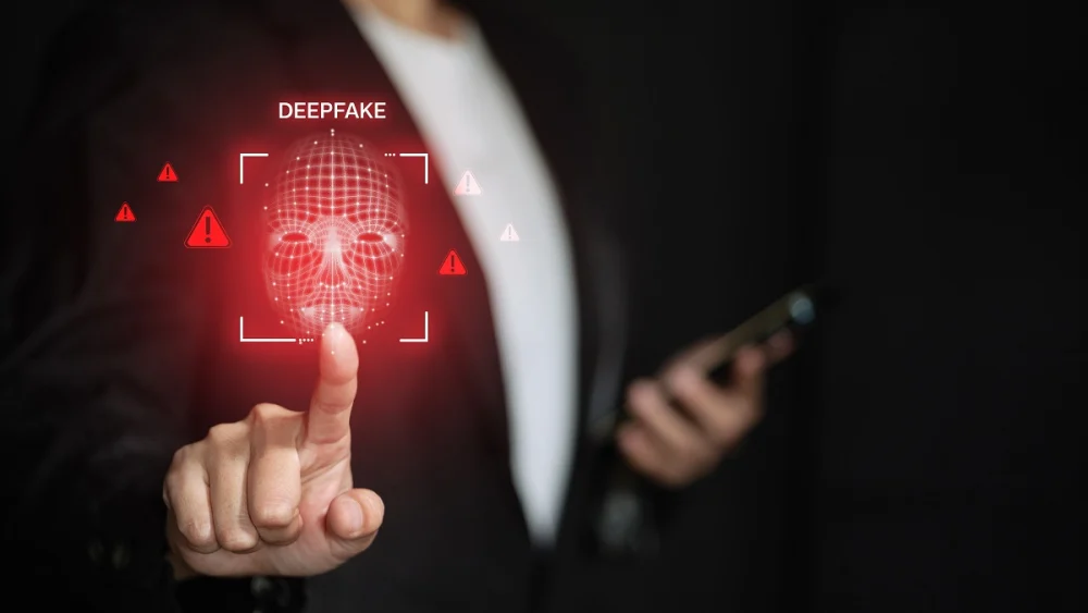 Person pointing at a digital deepfake face scan with red alert icons, symbolizing how KYC tools detect manipulated identities and prevent document or biometric fraud